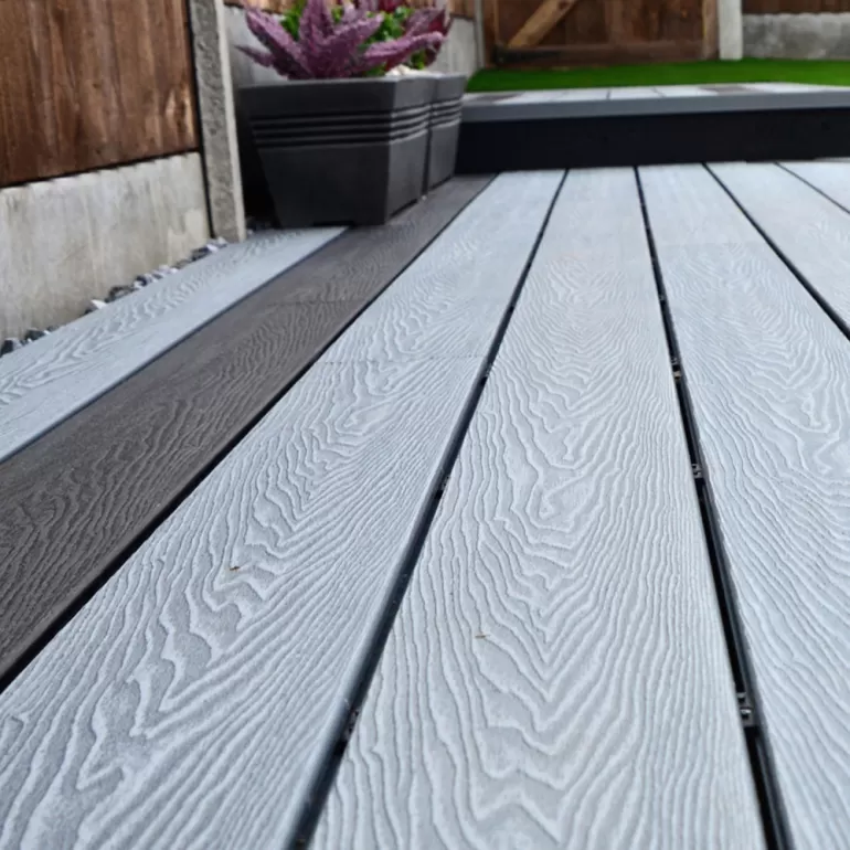 Create a border around the edge of your deck

If you have a dark deck, creating a lighter colour border using flax decking gives it an instant summer-fresh look.

You can also add a light colour composite deck railing to complement the design.